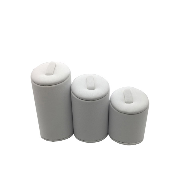 Set Of Three White Leatherette Ring Displays. Varying Heights. Set Of Three White Leatherette Ring Displays. Varying Heights.