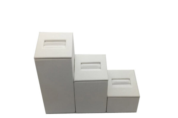 Set Of Three Square White Leatherette Ring Displays. Varying Heights.